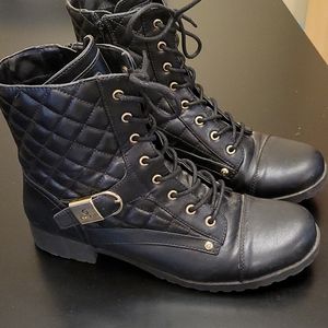Black combat boots by Guess